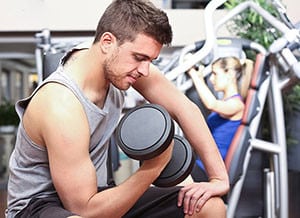 Handsome man training in a fitness club
